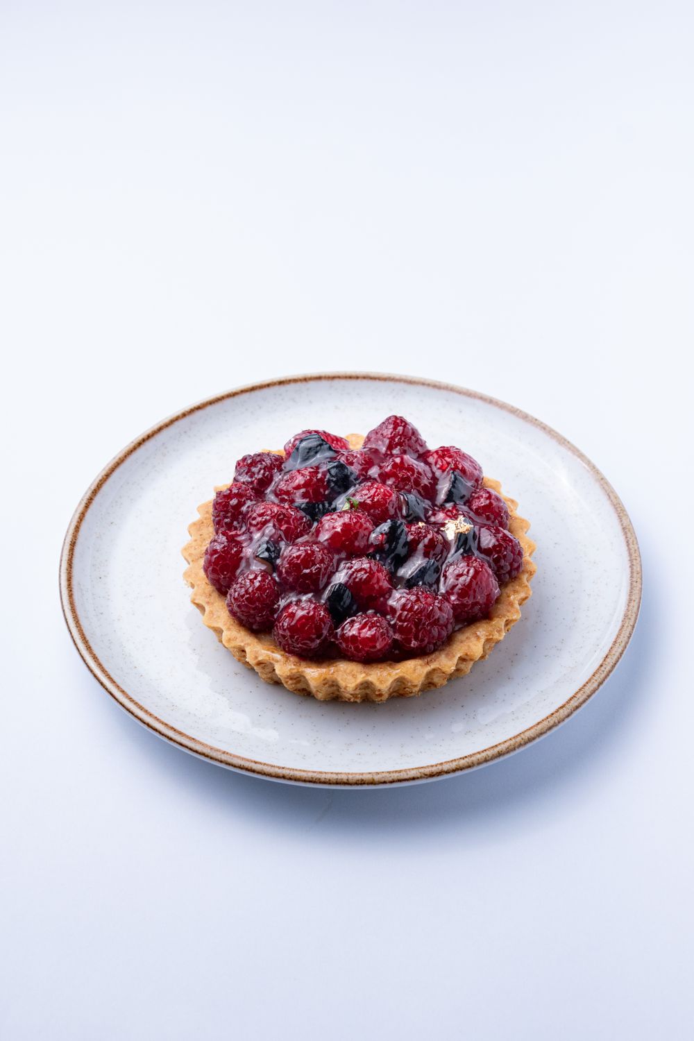 Tartaleta de frambuesa artesanal de Caneli Café